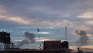 Smoke billows during Israeli bombardment over Rafah in the southern Gaza Strip on February 13, 2024. (Photo by MOHAMMED ABED / AFP)
