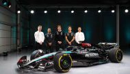 A handout image released by Mercedes on February 14, shows the team's British driver George Russell (2R), Team principal Toto Wolff (C), British driver Lewis Hamilton (2L), Technical Director James Allison (L) and Magaging Director of HPP, Hywel Thomas (R) posing with their new Mercedes-AMG F1 W15 E Performance Formula One racing car during their 2024 season launch, in Silverstone on February 14, 2024. (Photo by MERCEDES / AFP)