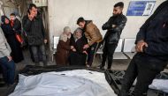 Palestinians mourn near the bodies of loved ones following Israeli bombardment on Rafah in the southern Gaza Strip, at al-Najar hospital on February 16, 2024 (Photo by MOHAMMED ABED / AFP)