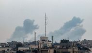 Smoke billowing over Khan Yunis in the southern Gaza Strip during Israeli bombardment on February 20, 2024. (Photo by Mohammed Abed / AFP)
 