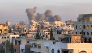 A picture taken in Gaza City shows smoke billowing in the background during Israeli bombardment on February 20, 2024. (Photo by AFP)