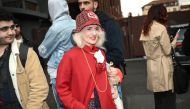 A person wearing a Gucci outfit is pictured in the street outside the Gucci collection show at the Milan Fashion Week Womenswear Autumn/Winter 2024-2025 on February 23, 2024 in Milan. (Photo by Marco Bertorello / AFP)
 