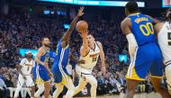 Nikola Jokic #15 of the Denver Nuggets shoot against Draymond Green #23 of the Golden State Warriors in the first quarter at Chase Center on February 25, 2024 in San Francisco, California. (Photo by Thearon W. Henderson / GETTY IMAGES NORTH AMERICA / Getty Images via AFP)
