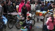 Palestinians buy and sell in a commercial street in Rafah in the southern Gaza Strip on March 1, 2024, amid ongoing battles between Israel and the Palestinian Hamas movement. (Photo by AFP)
