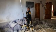 A Palestinian child stands in the living room of a building that was damaged during Israeli bombardment in Rafah, on the southern gaza Strip, on March 2, 2024 (Photo by AFP)