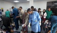 People receive medical attention at the Kuwaiti hospital for wounds sustained in an Israeli bombardment that hit a camp sheltering displaced Palestinians near the Emirati hospital, in Rafah in the southern Gaza Strip on March 2, 2024, amid the ongoing conflict between Israel and the Hamas movement. (Photo by AFP)
