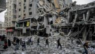  Palestinians walk amid the rubble of houses destroyed by Israeli bombardment in Gaza City on March 3, 2024. (Photo by AFP)
 