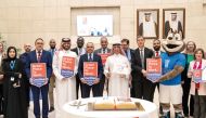 UDST President Dr. Salem Al Naemi (centre) and other officials gather to mark the achievement. 