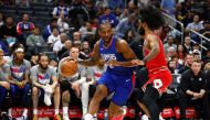 Kawhi Leonard #2 of the LA Clippers controls the ball against Coby White #0 of the Chicago Bulls in the second half at Crypto.com Arena on March 09, 2024 in Los Angeles, California. (Photo by RONALD MARTINEZ / GETTY IMAGES NORTH AMERICA / Getty Images via AFP)
