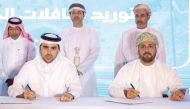 Ambassador of Qatar to Oman H E Sheikh Mubarak bin Fahad Al Thani (back left) with Karwa Motors and Omani officials during the agreement signing ceremony. 