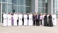 Qatar Airways officials and the graduate pilots. 