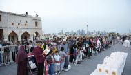 People receiving Iftaar packets as part of the Ramadan activities at Souq Waqif yesterday. PICS: Mohammed Farag