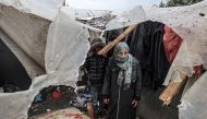 Displaced Palestinians inspect the damage to their tents following overnight Israeli bombardment at the Rafah refugee camp in the southern gaza Strip on March 19, 2024. (Photo by SAID KHATIB / AFP)
