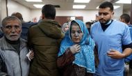 Wounded Palestinians arrive at the Al-Aqsa Martyrs Hospital in Deir al-Balah on March 19, 2024, following Israeli bombardment in the Nuseirat refugee camp in the central gaza Strip. (Photo by AFP)
