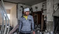 An injured boy inspects the rubble and debris of a building that was hit by overnight Israeli bombardment in Rafah in the southern gaza Strip on March 19, 2024. (Photo by SAID KHATIB / AFP)
