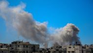  A picture shows smoke billowing after Israeli bombardment in the vicinity of the Al-Shifa hospital in gaza City on March 23, 2024. (Photo by AFP) 