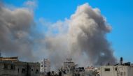 A picture shows smoke billowing after Israeli bombardment in the vicinity of the Al-Shifa hospital in Gaza City on March 23, 2024. (Photo by AFP)