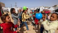 Children take part in organised activities at a camp for displaced Palestinians in Rafah, in the southern Gaza Strip, on March 26, 2024. Photo by MOHAMMED ABED / AFP.