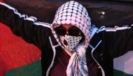 A pro-Palestinian demonstrators holds a flag during the 