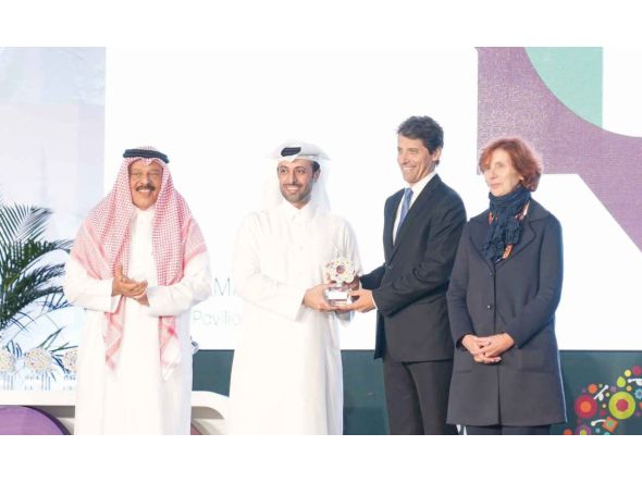  Minister of Municipality H E Abdullah bin Hamad bin Abdullah Al handing over the award to Italian Ambassador to Qatar H E Paolo Toschi.