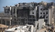 Palestinians inspect the damage at Gaza's Al-Shifa hospital after the Israeli military withdrew from the complex housing the hospital on April 1, 2024. (Photo by AFP)
 