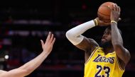 LeBron James #23 of the Los Angeles Lakers shoots against the Washington Wizards during the second half at Capital One Arena on April 03, 2024 in Washington, DC. Patrick Smith/Getty Images/AFP 