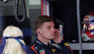 Red Bull Racing's Dutch driver Max Verstappen looks on from the pit before the qualifying session for the Formula One Japanese Grand Prix race at the Suzuka circuit in Suzuka, Mie prefecture on April 6, 2024. (Photo by Kim Kyung-Hoon / Pool / AFP)