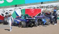 RB's Australian driver Daniel Ricciardo (L) gets out of his car after crashing out with Williams' Thai driver Alexander Albon (R-in car) during the Formula One Japanese Grand Prix race at the Suzuka circuit in Suzuka, Mie prefecture on April 7, 2024. (Photo by JIJI PRESS / AFP) / Japan OUT