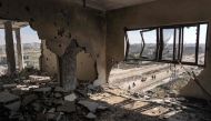 This picture taken on April 7, 2024 shows a view from atop a heavily damaged building of a street in Khan Yunis. (Photo by AFP)
