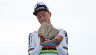 Alpecin - Deceuninck team's Dutch rider Mathieu Van Der Poel celebrates on the podium after winning the 121st edition of the Paris-Roubaix one-day classic cycling race, 260km between Compiegne and Roubaix, northern France, on April 7, 2024. (Photo by Francois LO PRESTI / AFP)
