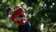 Tiger Woods of the United States plays his shot from the fourth tee during the final round of the 2024 Masters Tournament at Augusta National Golf Club on April 14, 2024 in Augusta, Georgia. (Photo by Warren Little / GETTY IMAGES NORTH AMERICA / Getty Images via AFP)
