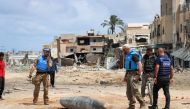 A UN team inspects an unexploded 1,000-pound bomb lying on a main road in Khan Younis. Pic: UNOCHA/Themba Linden 