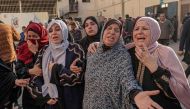 Palestinians mourn the death of loved ones following Israeli bombardment in Maghazi in the central Gaza Strip, on April 16, 2024. (Photo by AFP)