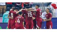 Qatar players celebrate a goal against Indonesia on Monday. 