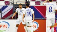 Uzbekistan’s Ulugbek Khoshimov (left) celebrates after scoring team’s second goal. PIC: AFC