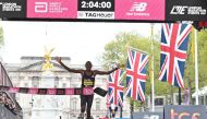 Kenya's Alexander Mutiso Munyao crosses the line to win the men's race at the 2024 London Marathon in central London on April 21, 2024. (Photo by Justin Tallis / AFP) 
 