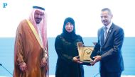 Minister of Public Health H E Dr. Hanan Al Kuwari receving the ‘Visionary Leader Award in Health System Excellence’ award from President of Arab Hospitals Federation Fadi Alame; as General Secretary Prof. Tawfik Khoja looks on. Pic: Rajan Vadakkemuriyil/The Peninsula.