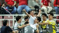 Iraq’s Ali Jasim celebrates with teammates after scoring his team’s second goal against Indonesia at Abdullah Bin Khalifa Stadium in Doha, yesterday. PICS: AFP