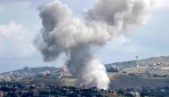 This picture taken from the northern Israeli kibbutz of Malkia along the border with southern lebanon, shows smoke billowing above the Lebanese village of Meiss El-Jabal during Israeli bombardment on May 5, 2024. (Photo by Jalaa MAREY / AFP)