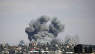 A picture taken on May 6, 2024 shows smoke billowing following bombardment east of rafah in the southern Gaza Strip. (Photo by AFP)
