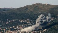 Smoke billows over the southern Lebanese village of Kfar Kila following Israeli bombardment on May 10, 2024. (Photo by Rabih DAHER / AFP)
