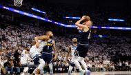 Nikola Jokic #15 of the Denver Nuggets takes a shot over Rudy Gobert #27 of the Minnesota Timberwolves during the fourth quarter in Game Four of the Western Conference Second Round Playoffs at Target Center on May 12, 2024 in Minneapolis, Minnesota. (Photo by David Berding / GETTY IMAGES NORTH AMERICA / Getty Images via AFP)
