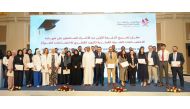 Minister of Public Health H E Dr. Hanan Al Kuwari and Director of the Healthcare Professions Department at the Ministry of Public Health Dr. Saad Al Kaabi with the doctors who obtained certificates. 