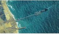 This handout picture courtesy of the US Central Command (CENTOCOM) taken on May 16, 2024 shows US Army soldiers emplace the Trident Pier on the Gaza coast. (Photo by US Central Command (CENTCOM) / AFP) 