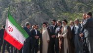 A handout picture provided by the Iranian presidency shows Iran's President Ebrahim Raisi (C) at the site of Qiz Qalasi, the third dam jointly built by Iran and Azerbaijan on the Aras River, ahead of its inauguration ceremony on May 19, 2024. Photo by Iranian Presidency / AFP