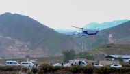 In this photo provided by Islamic Republic News Agency IRNA on May 19, 2024, shows the helicopter carrying Iran's President Ebrahim Raisi taking off at the Iranian border with Azerbaijan after the inauguration of the dam of Qiz Qalasi, in Aras. (Photo by Ali Hamed Haghdoust / IRNA / AFP)