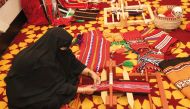 A woman doing a traditional Bedouin weaving called Sadu during a symposium at Katara yesterday to celebrate the International Day for Cultural Diversity, which falls every May 21 annually.