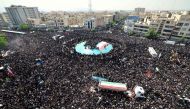 Mourners attend the funeral of Iran's President Ebrahim Raisi, in Tehran on May 22, 2024. (Photo by ATTA KENARE / AFP)