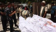 Palestinians transport the bodies of gazans killed in an Israeli strike to a clinic in gaza City on May 25, 2024. (Photo by Omar AL-QATTAA / AFP)
