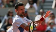 Serbia's Novak Djokovic takes part in a practice session during the French Open tennis tournament on Court Philippe-Chatrier at the Roland Garros Complex in Paris on May 25, 2024. (Photo by ALAIN JOCARD / AFP)